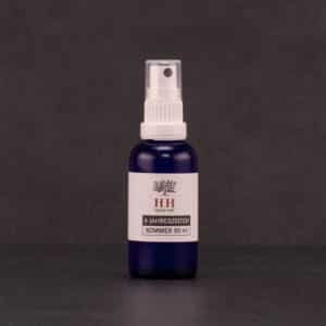 Aromaspray Frühling auf einem schwarzen Hintergrund.