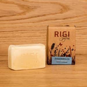 Ziegenmilchseife ausgepackt und Kartonverpackung daneben